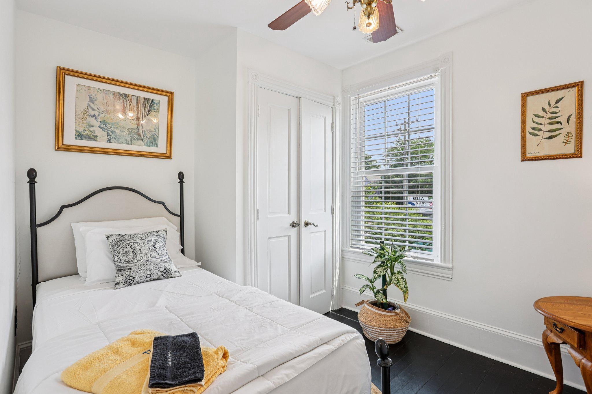 414 Broadway, Unit 414 West Cape May, NJ 08204 - Photo 47 of 48 a bedroom with a bed and a window