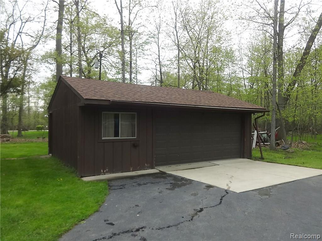 8680 Ferry Road Grosse Ile, MI 48138 - Photo 9 of 28 Large 2 car garage with work area and electricity