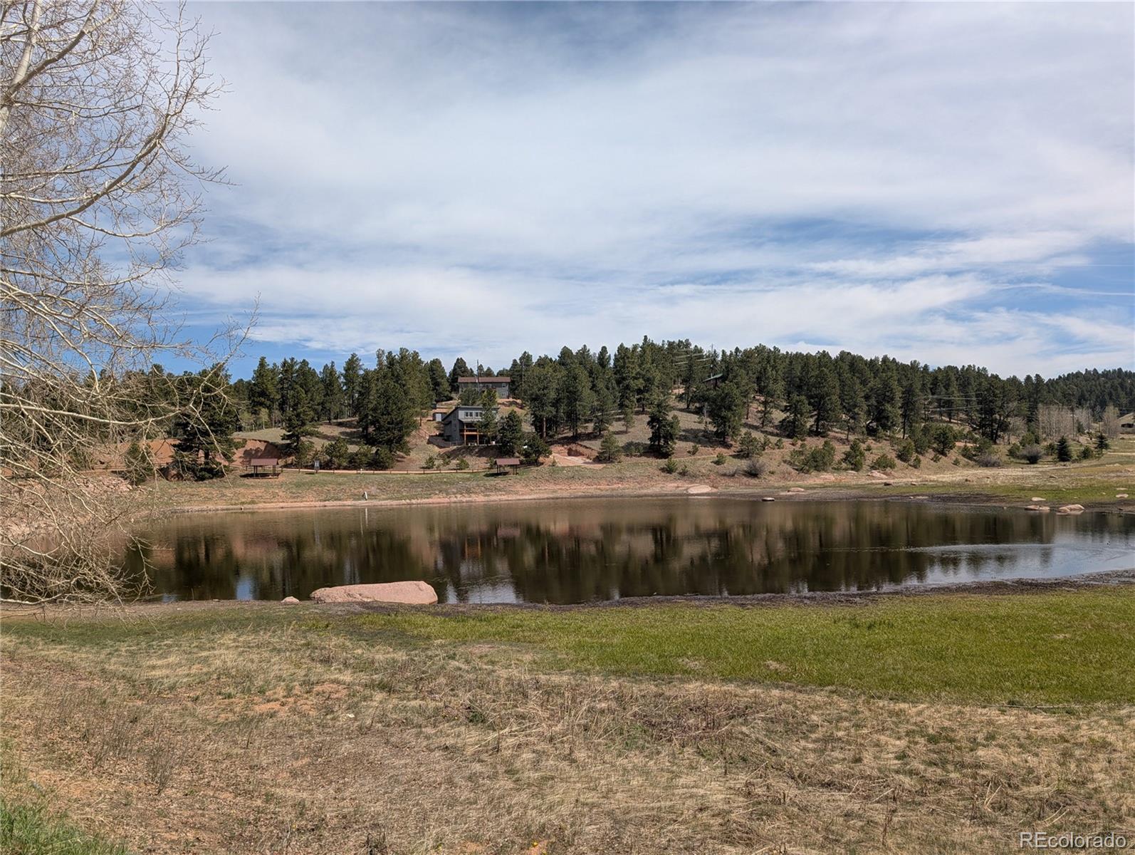 971 Spring Valley Lane Florissant, CO 80816 - Photo 9 of 14 a view of lake with green space