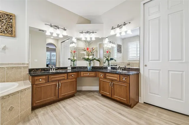 a kitchen with stainless steel appliances granite countertop a sink and cabinets