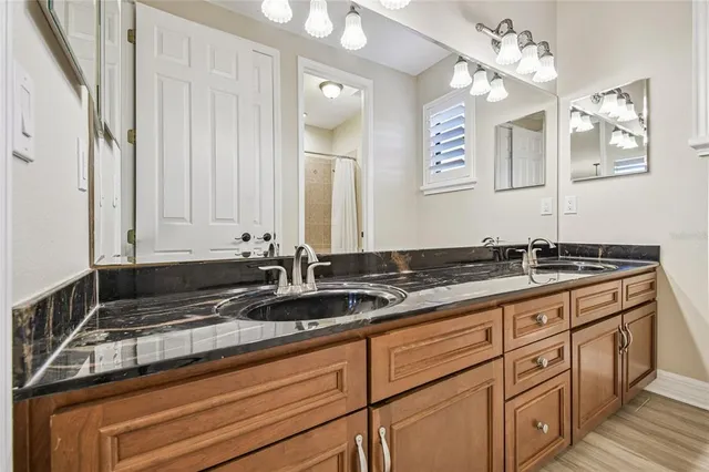 a bathroom with a toilet and a shower curtain