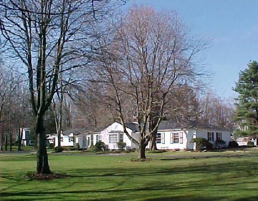 105 Silver Hill Road Ridgefield, CT 06877 - Photo 1 of 1 a brick house with trees in front of it