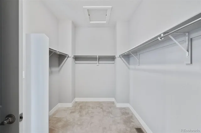 a view of an empty walk in closet