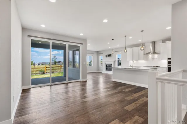 a view of kitchen with kitchen island and stainless steel appliances