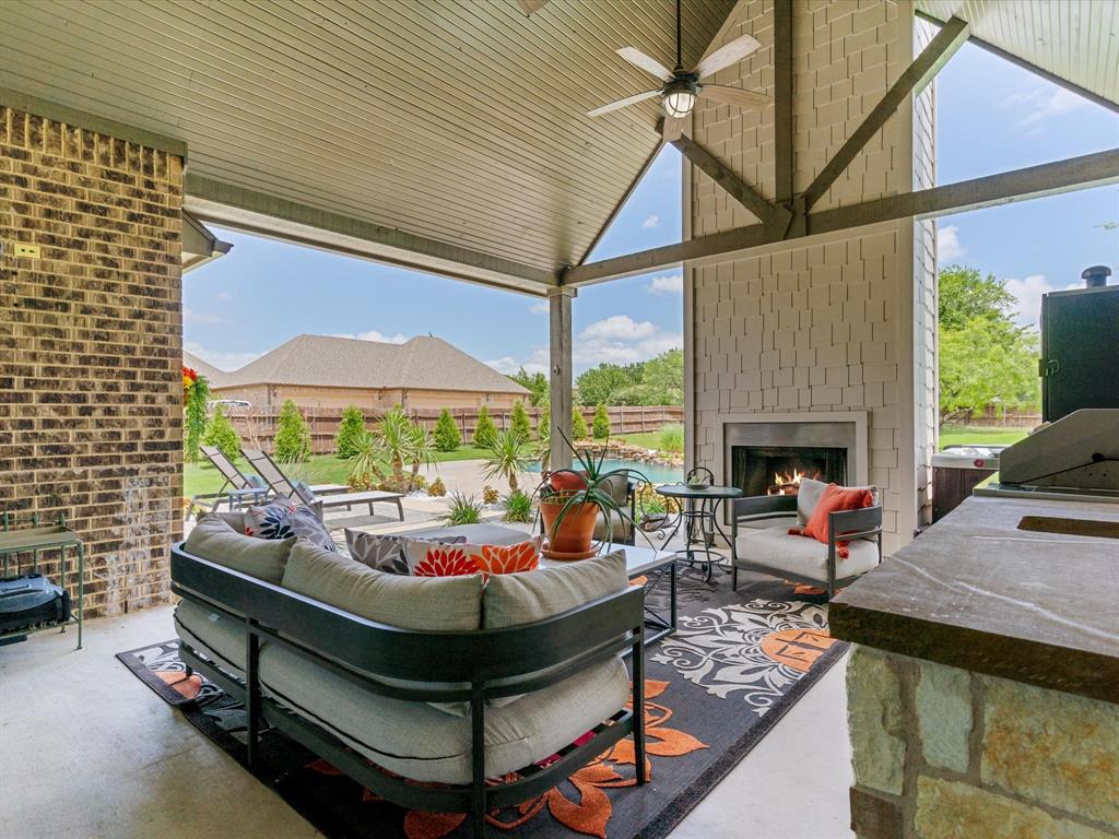 111 Old Base Road Aurora, TX 76078 - Photo 31 of 38 Covered outdoor living area overlooking the pool and backyard oasis