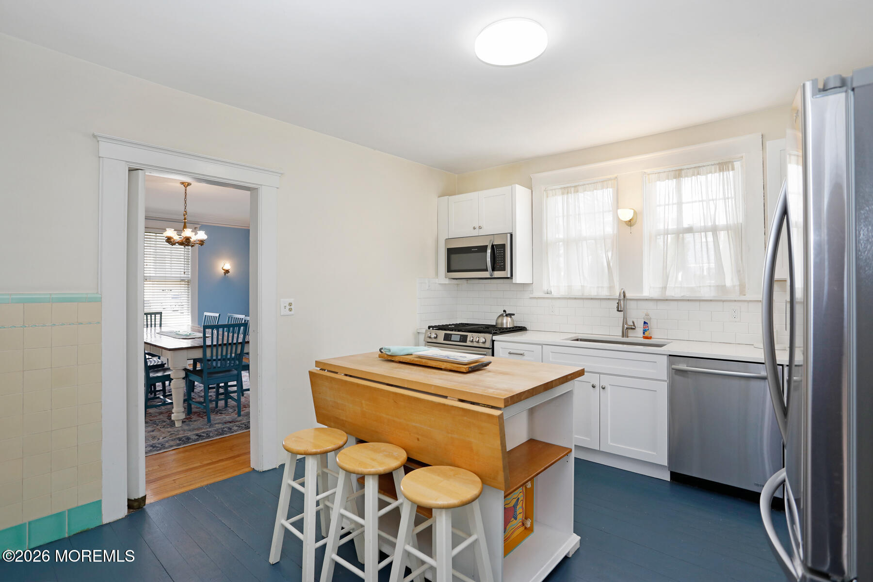 340 East Main Street Manasquan, NJ 08736 - Photo 20 of 46 a kitchen with stainless steel appliances a stove a sink refrigerator and a table