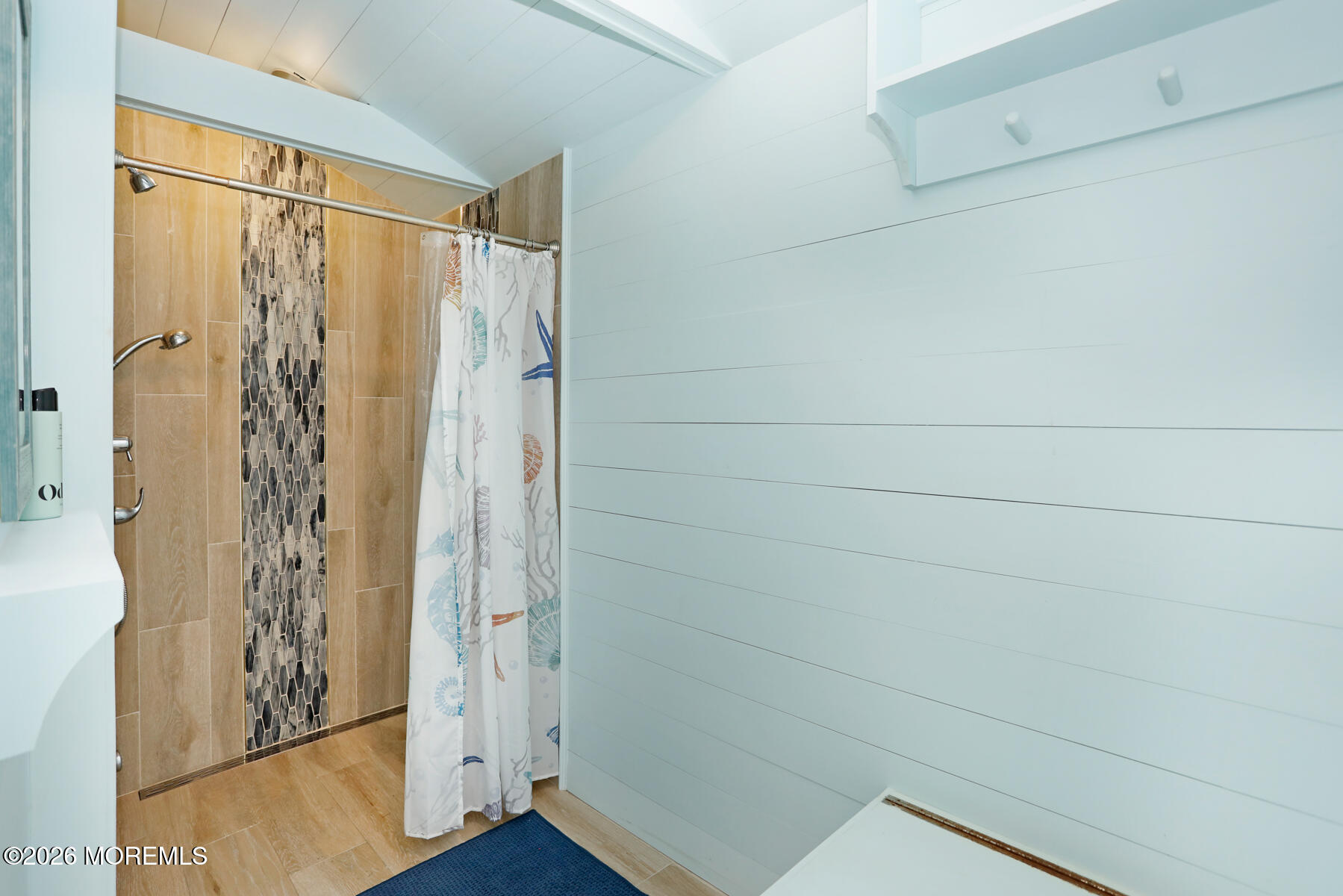 340 East Main Street Manasquan, NJ 08736 - Photo 38 of 46 a bathroom with a shower and a glass door
