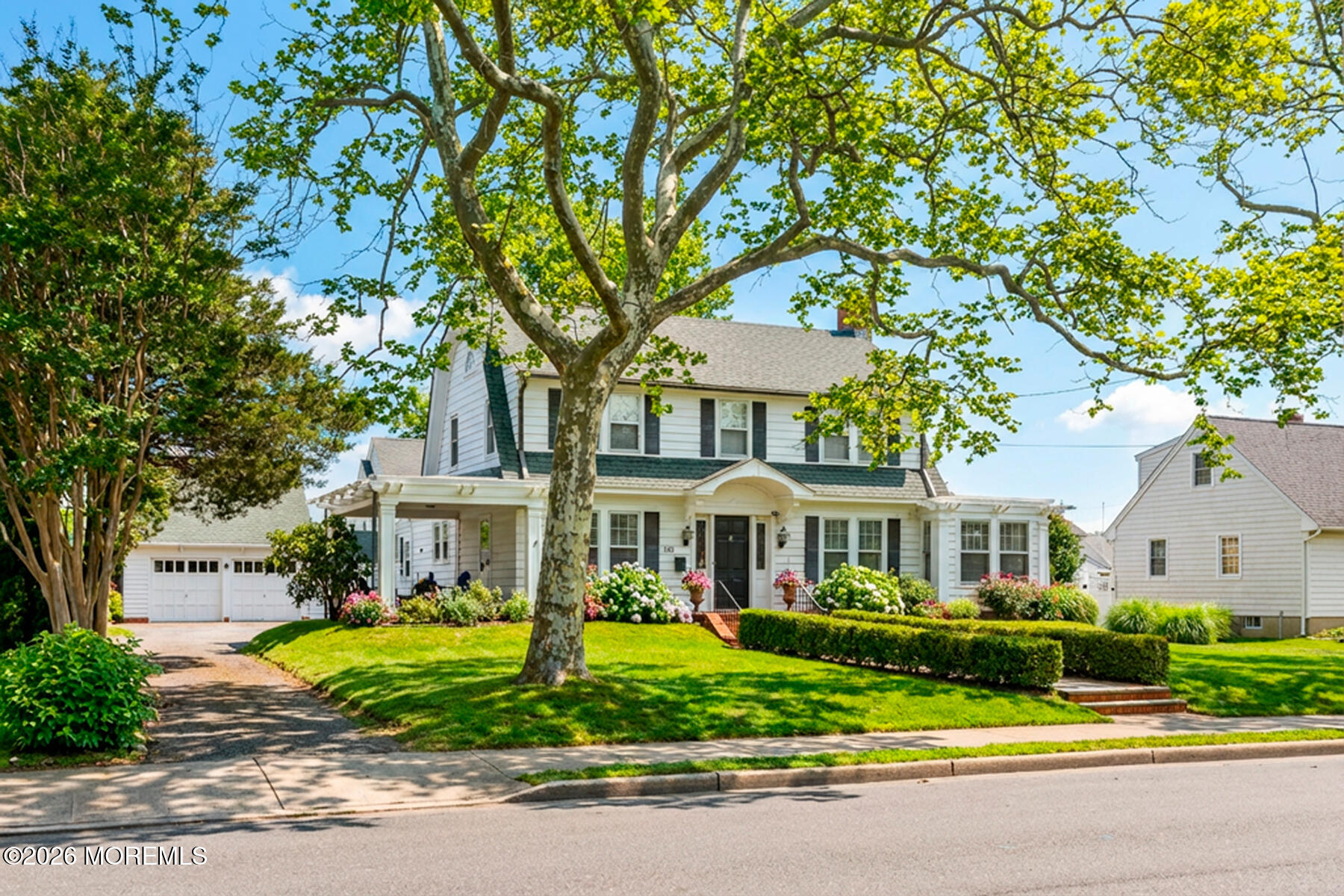 340 East Main Street Manasquan, NJ 08736 - Photo 5 of 46 a front view of a house with a yard