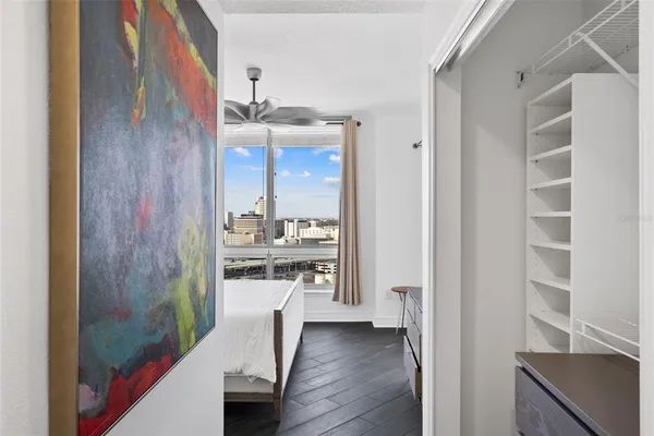 a view of hallway with wooden floor