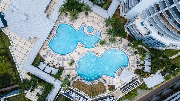 an aerial view of a house with garden space swimming pool and outdoor seating