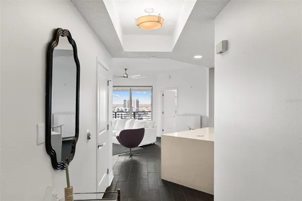 a view of living room with furniture and chandelier