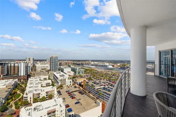 a view of a balcony with furniture