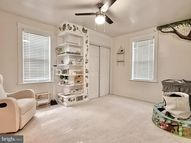 a view of livingroom with furniture and windows