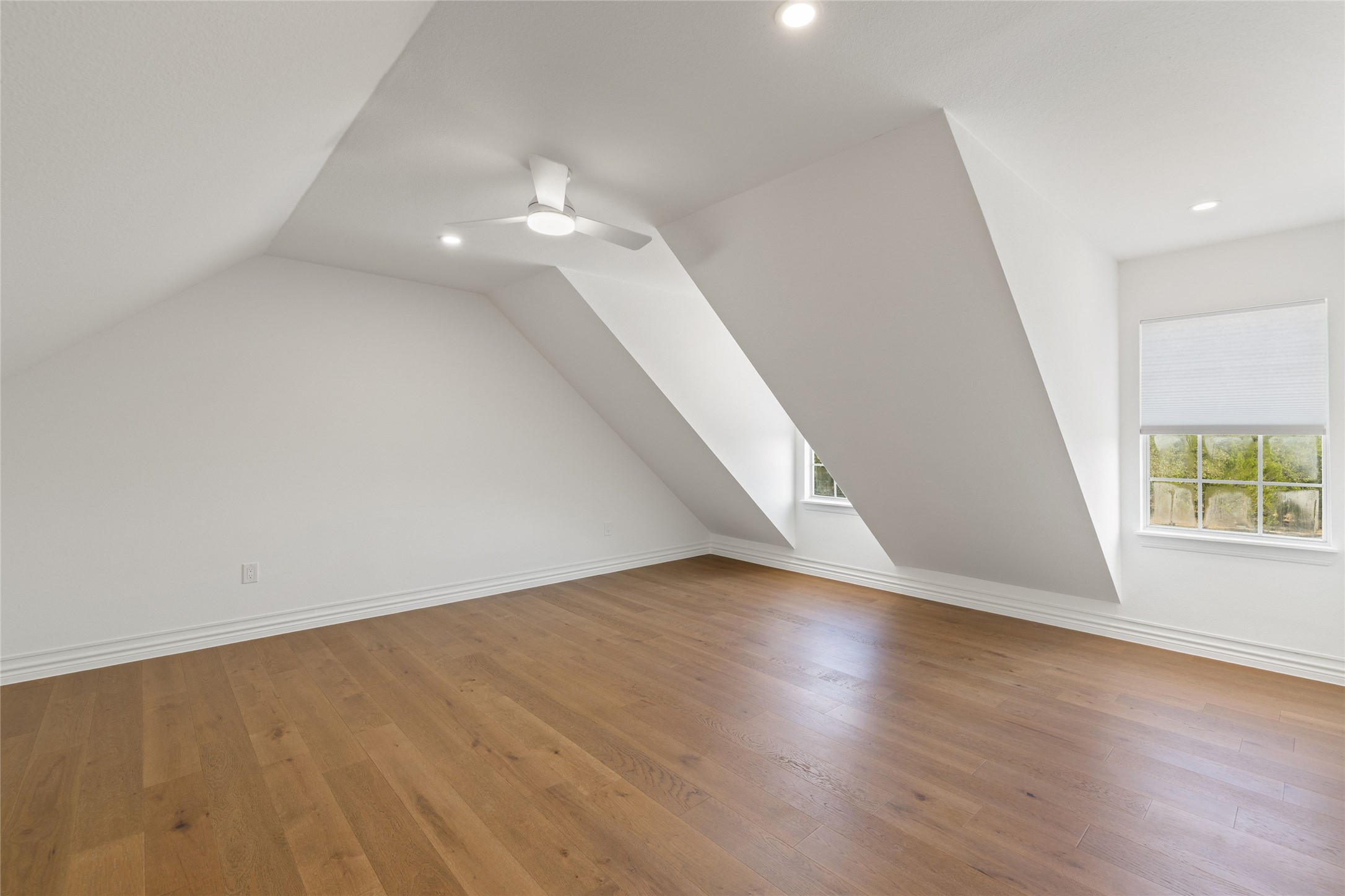 601 Hays Country Acres Road Dripping Springs, TX 78620 - Photo 26 of 38 Angled ceilings and warm hardwood floors define this versatile upper-level space.