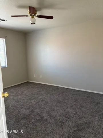 an empty room with a empty space and windows