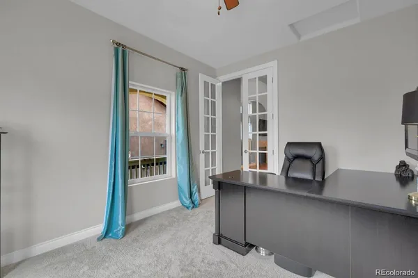 a view of a livingroom with furniture and window