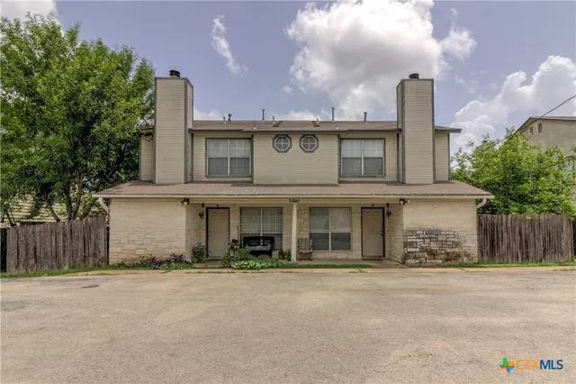 front view of a house with a street