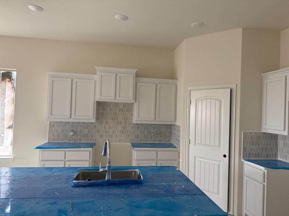 1217 Colca Drive Springtown, TX 76082 - Photo 4 of 9 a living room with kitchen view and a wooden floor