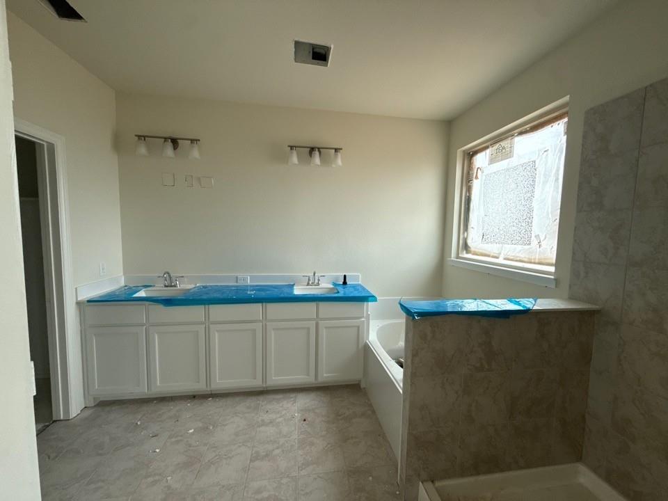 1217 Colca Drive Springtown, TX 76082 - Photo 7 of 9 a room with storage and utility