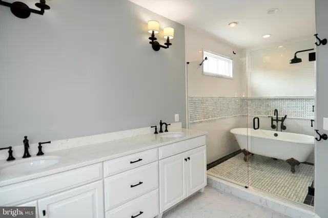a bathroom with a shower and a sink