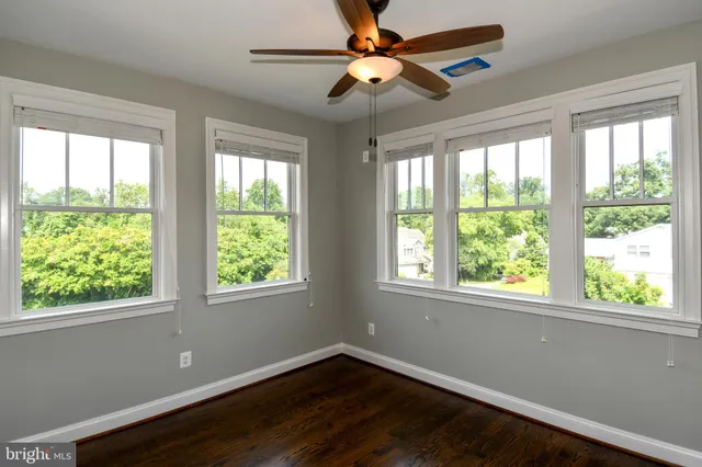 a view of a kitchen with a sink and a window