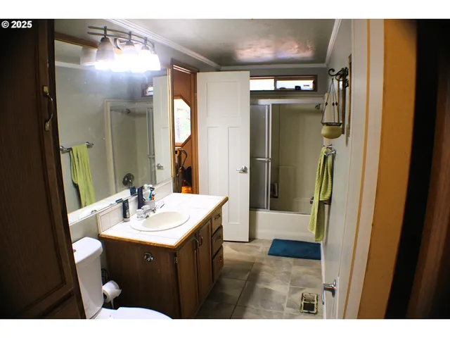 a bathroom with a sink vanity and a mirror
