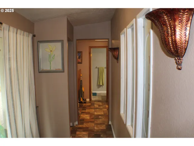 a view of a bathroom from a hallway