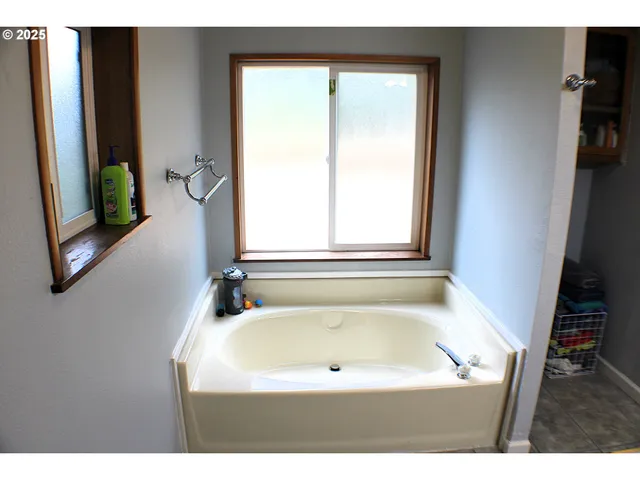 a bathroom with a bath tub