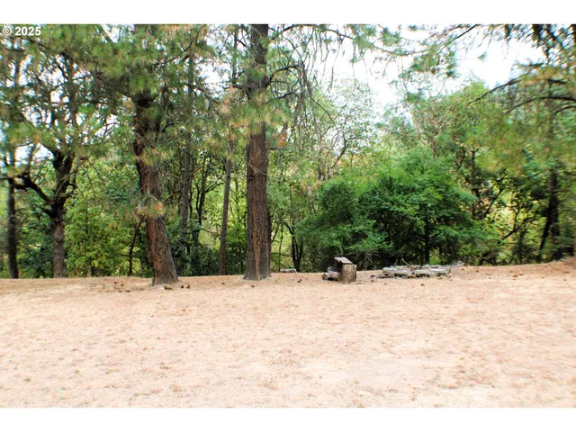 an aerial view of a house with yard