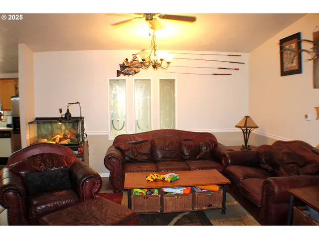 a bedroom with furniture and a chandelier