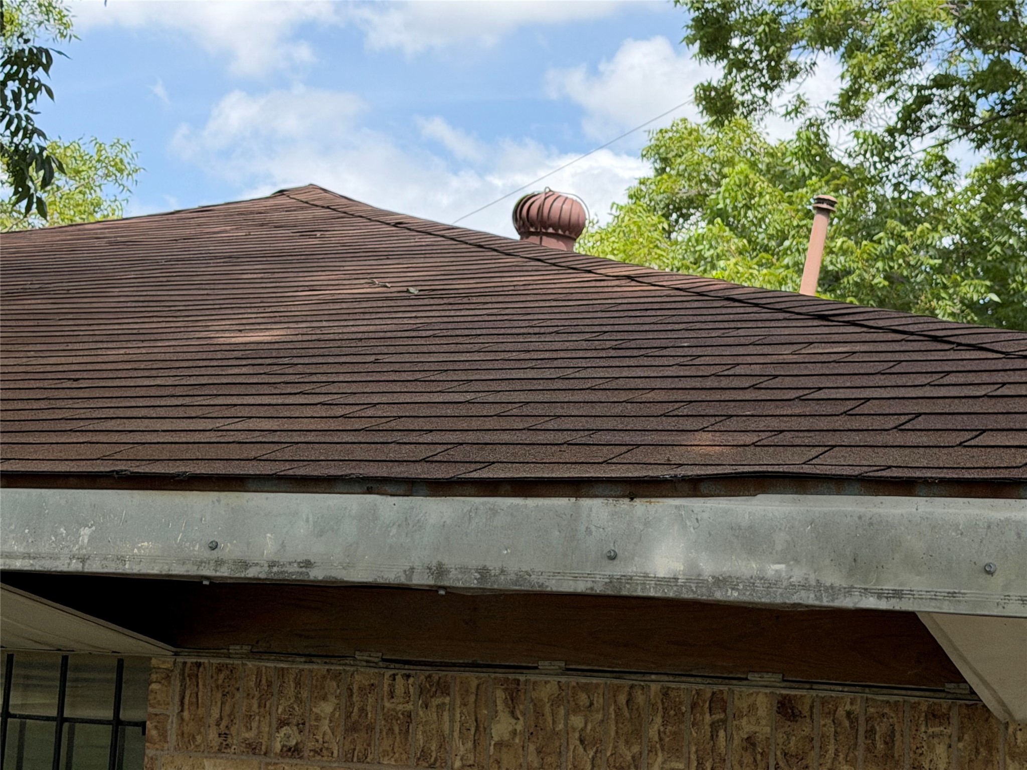 2501 Barnhardt Road Temple, TX 76502 - Photo 25 of 25 A classic shingle roof crowns a brick-clad home, hinting at durable construction and timeless appeal.