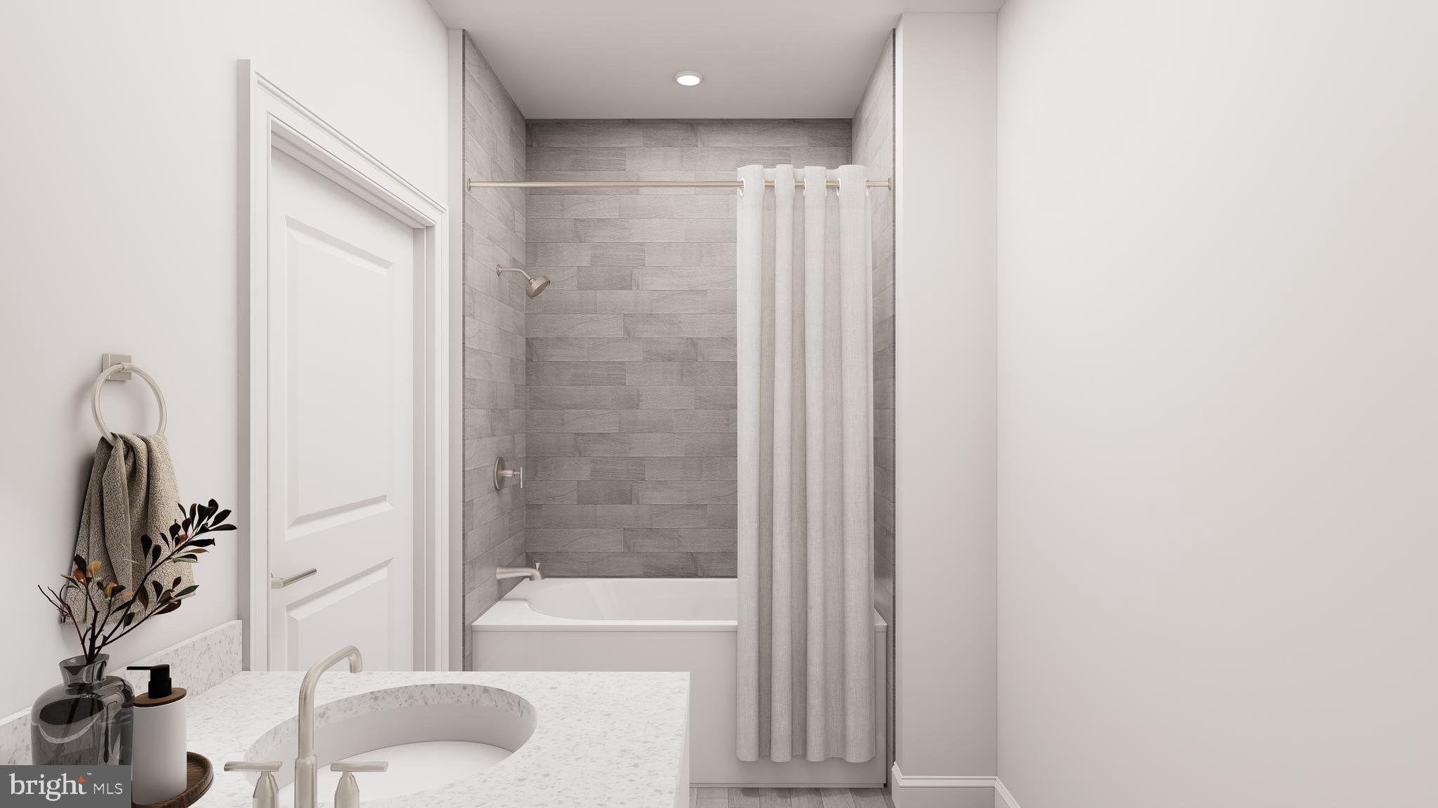 83 Bethlehem Pike, Unit 1306 Colmar, PA 18915 - Photo 14 of 19 a bathroom with a bathtub and a sink