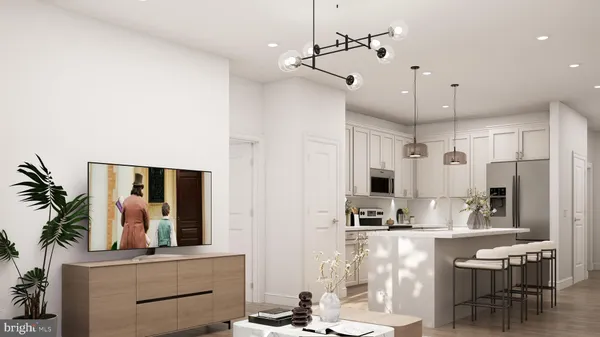 a view of living room with kitchen island furniture and a ceiling fan
