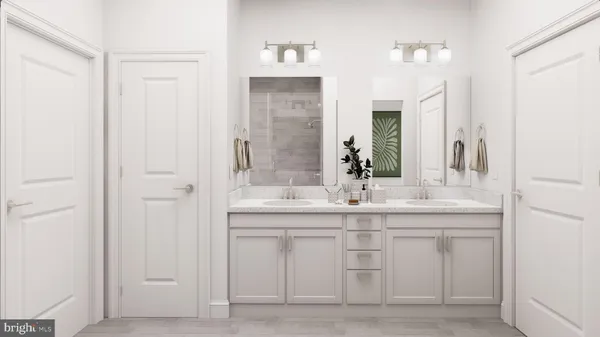 a bathroom with a double vanity sink and mirror