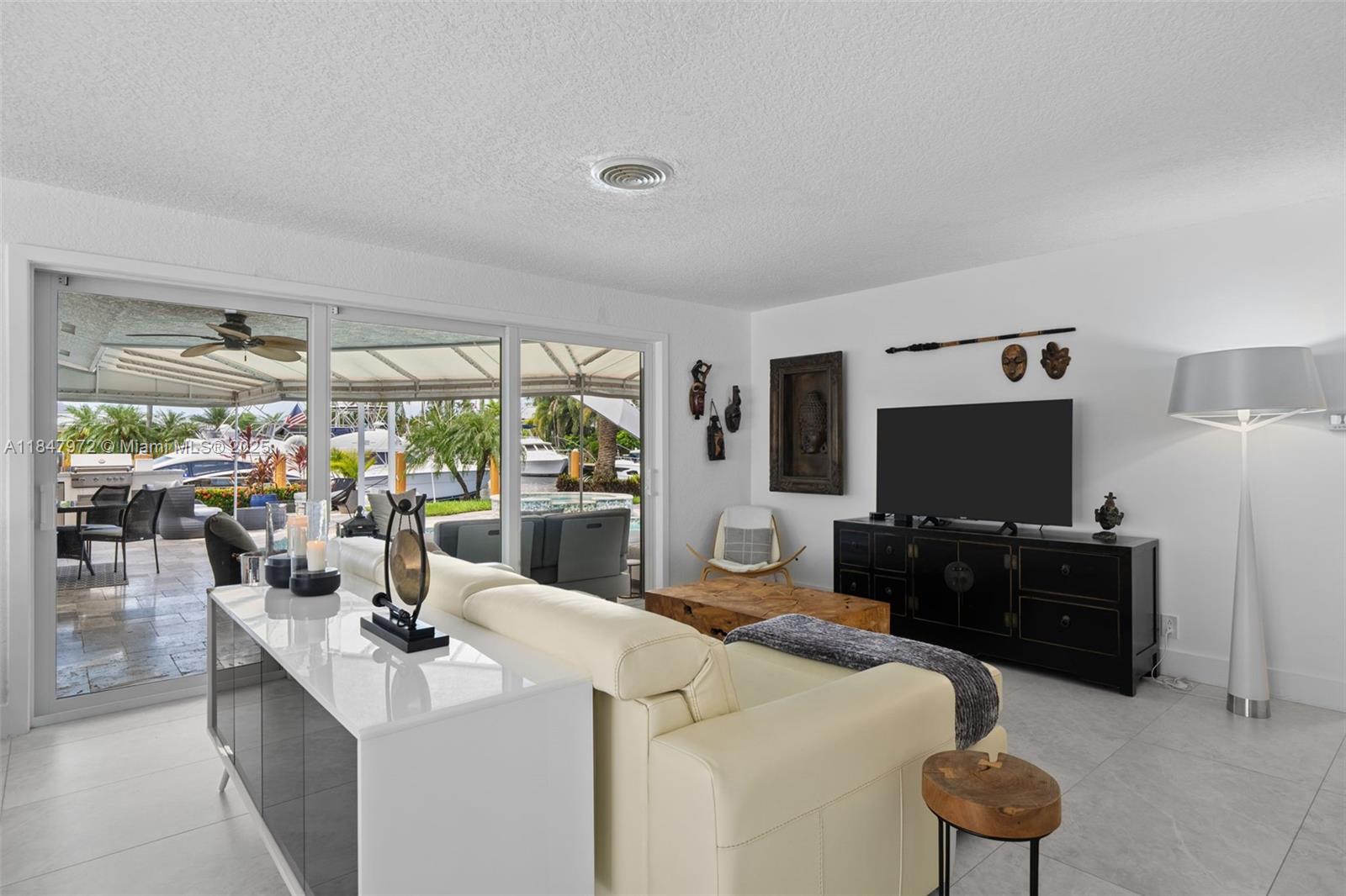 2681 Northeast 9th Court Pompano Beach, FL 33062 - Photo 12 of 58 a view of a livingroom with furniture window and outside view