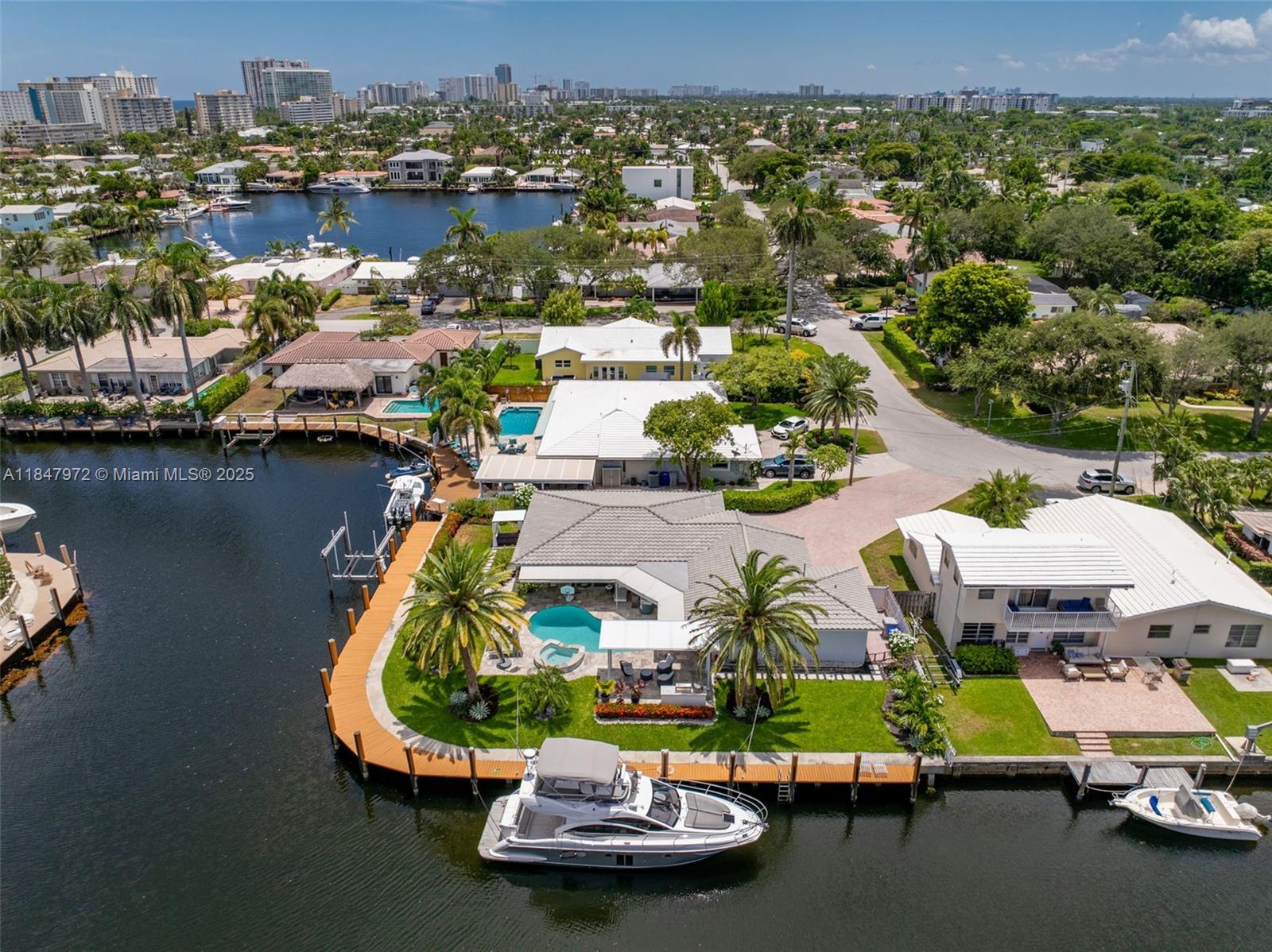 2681 Northeast 9th Court Pompano Beach, FL 33062 - Photo 2 of 58 an aerial view of a house with a lake view