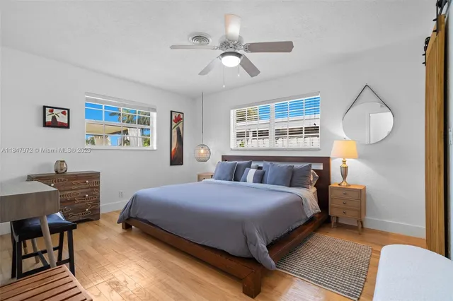 a bed room with a bed and a chandelier