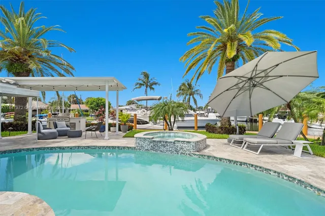 a view of a patio with couches chairs and a fire pit
