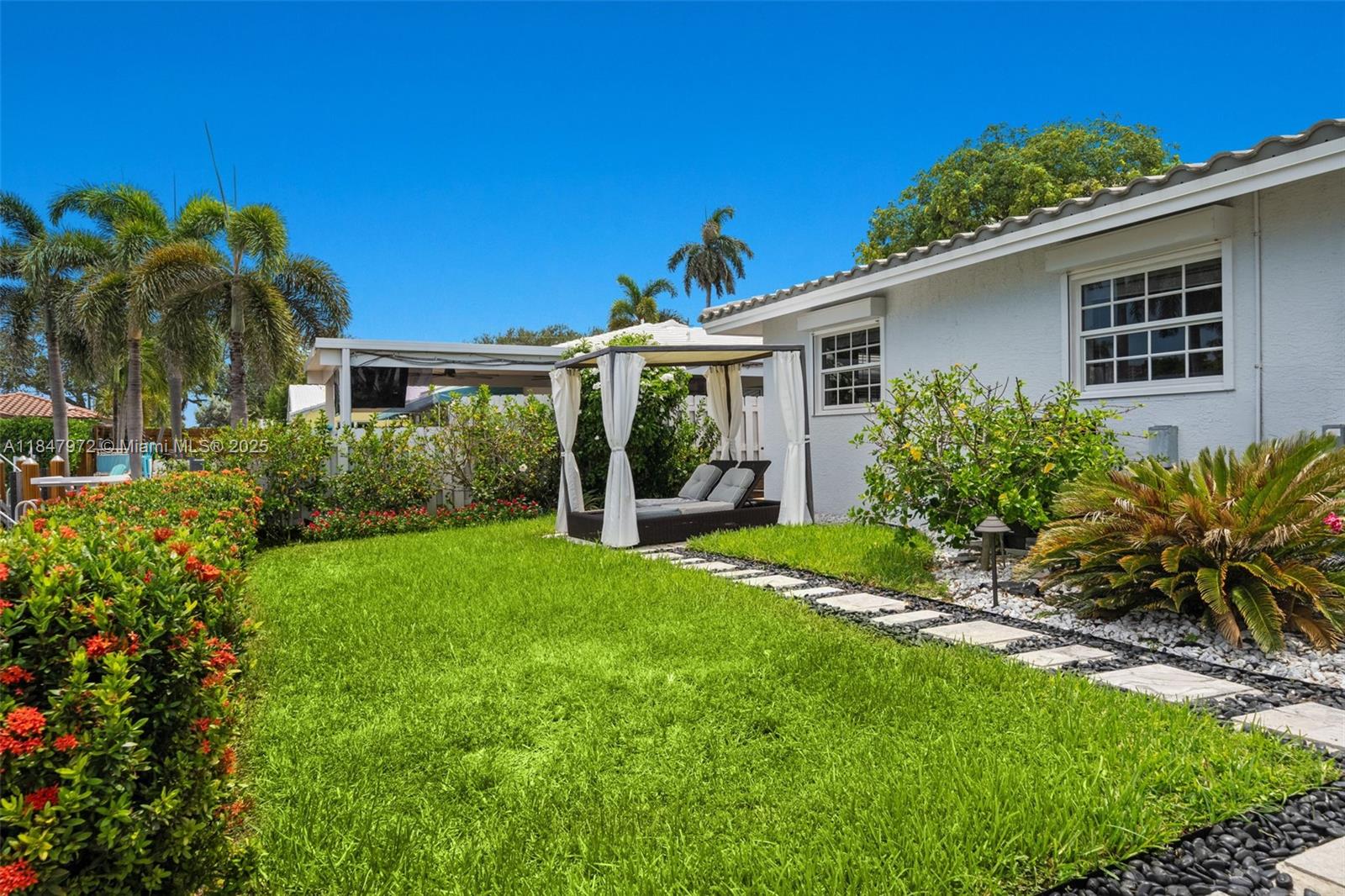 2681 Northeast 9th Court Pompano Beach, FL 33062 - Photo 41 of 58 a front view of house with yard and green space