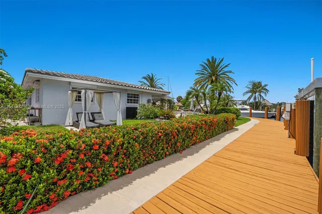 an aerial view of a house with a lake view