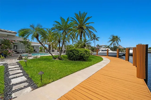 an aerial view of a house with swimming pool