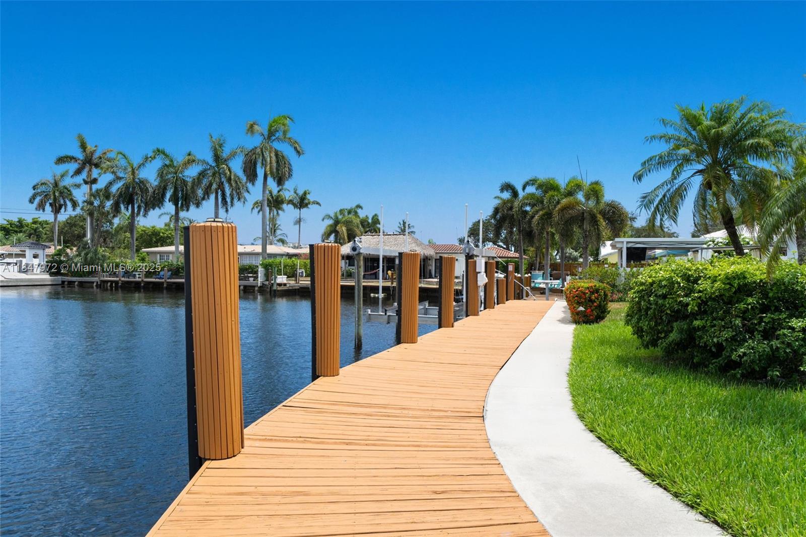 2681 Northeast 9th Court Pompano Beach, FL 33062 - Photo 45 of 58 a view of swimming pool with outdoor seating and plants