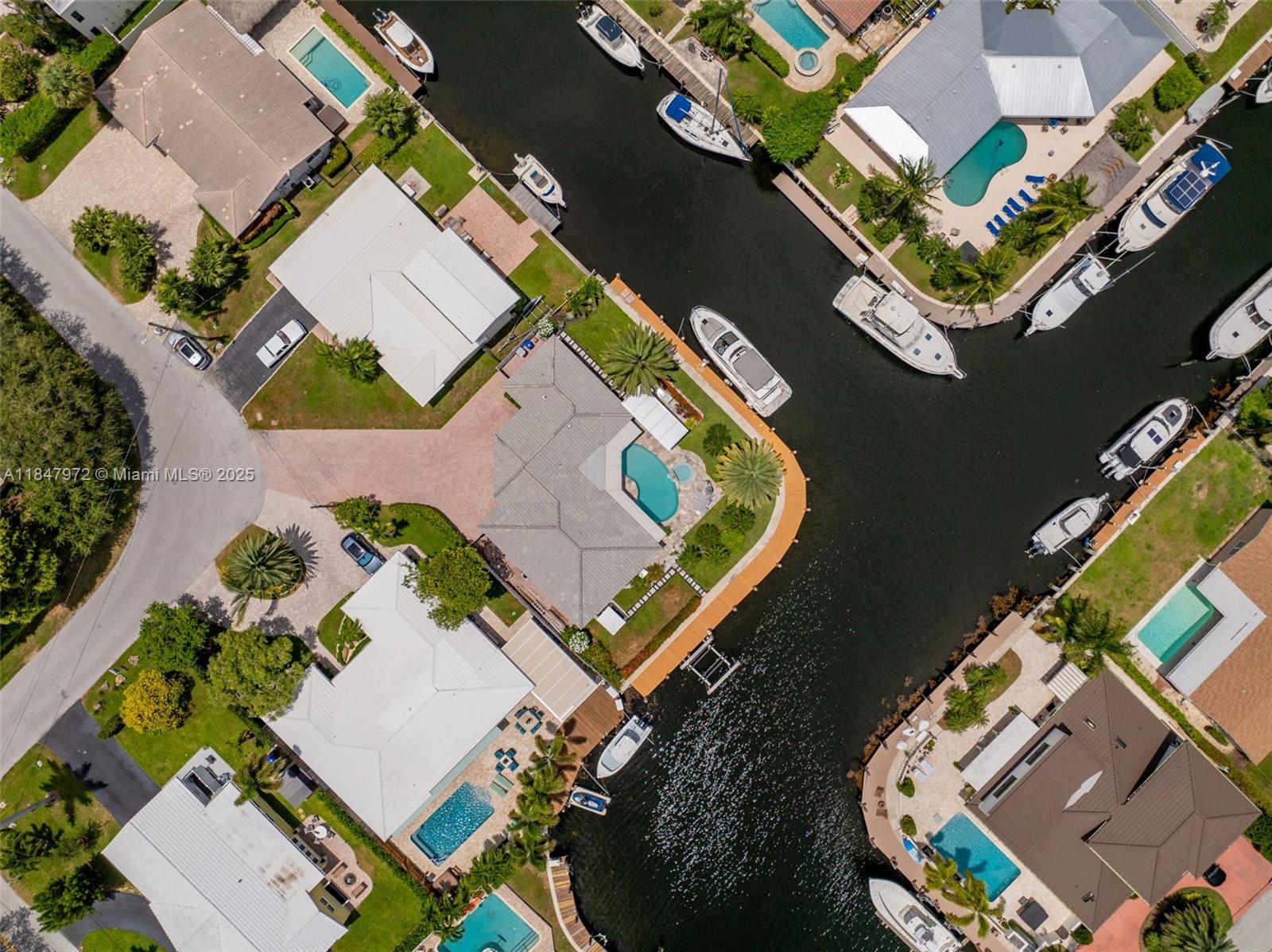 2681 Northeast 9th Court Pompano Beach, FL 33062 - Photo 46 of 58 an aerial view of a house with a swimming pool