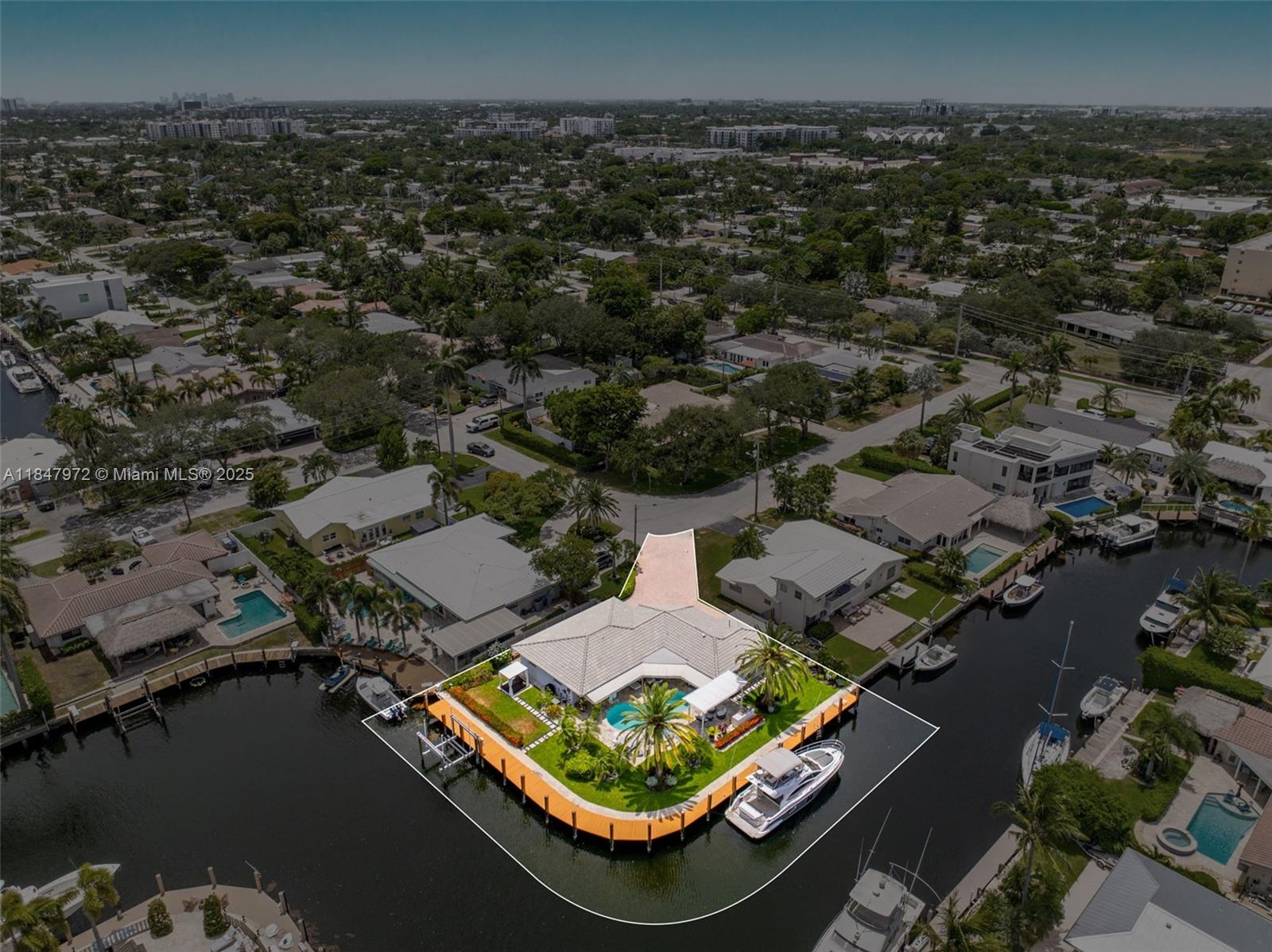 2681 Northeast 9th Court Pompano Beach, FL 33062 - Photo 47 of 58 an aerial view of a house with a lake