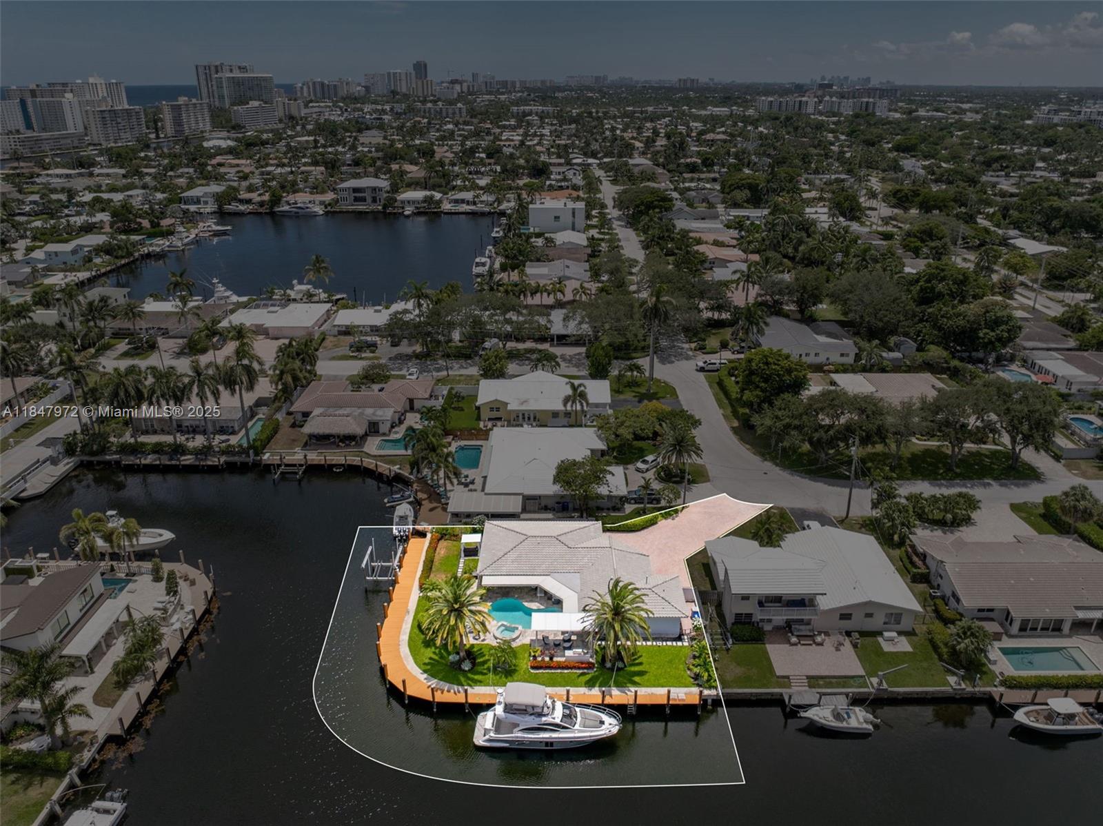 2681 Northeast 9th Court Pompano Beach, FL 33062 - Photo 48 of 58 an aerial view of a house with a lake view