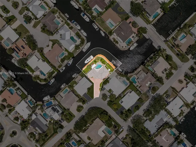 an aerial view of a house with a lake view