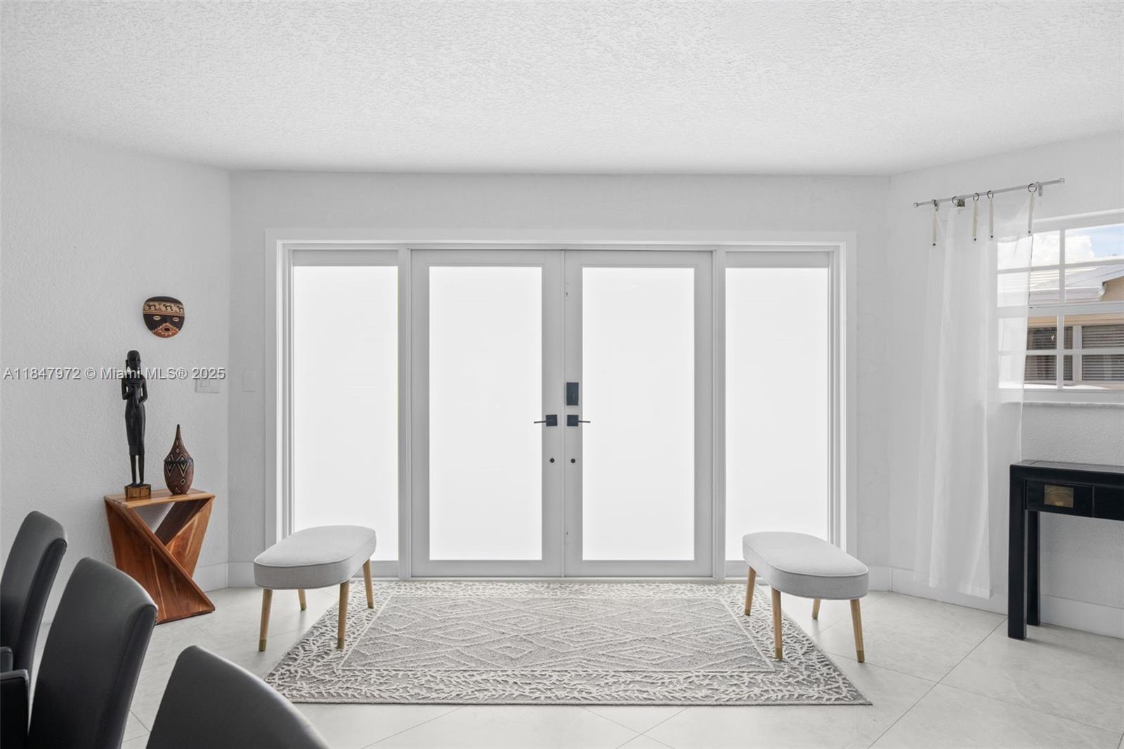 2681 Northeast 9th Court Pompano Beach, FL 33062 - Photo 10 of 58 a view of a livingroom with lounge chair and a window