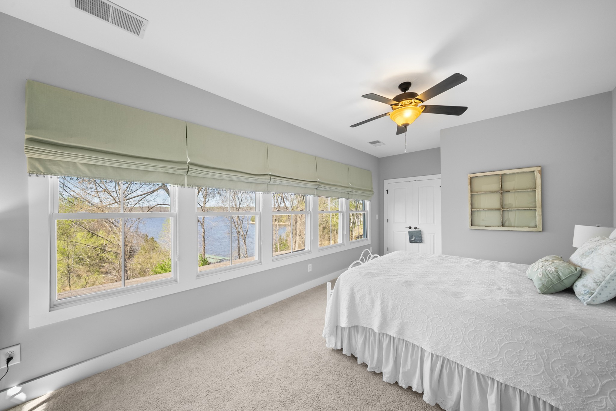 369 Fanning Bend Drive Winchester, TN 37398 - Photo 28 of 54 a bedroom with a large bed and a chandelier