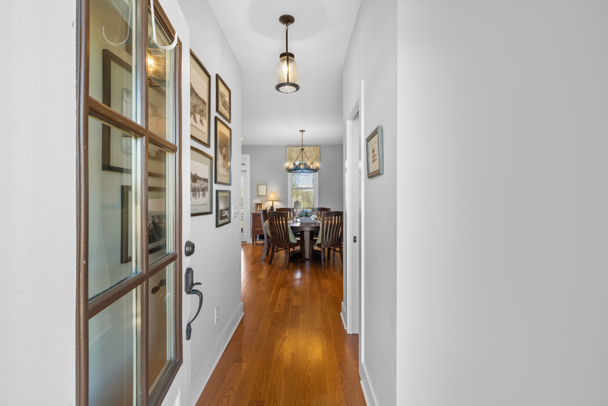 369 Fanning Bend Drive Winchester, TN 37398 - Photo 6 of 54 a hallway with a large dining table and a chandelier