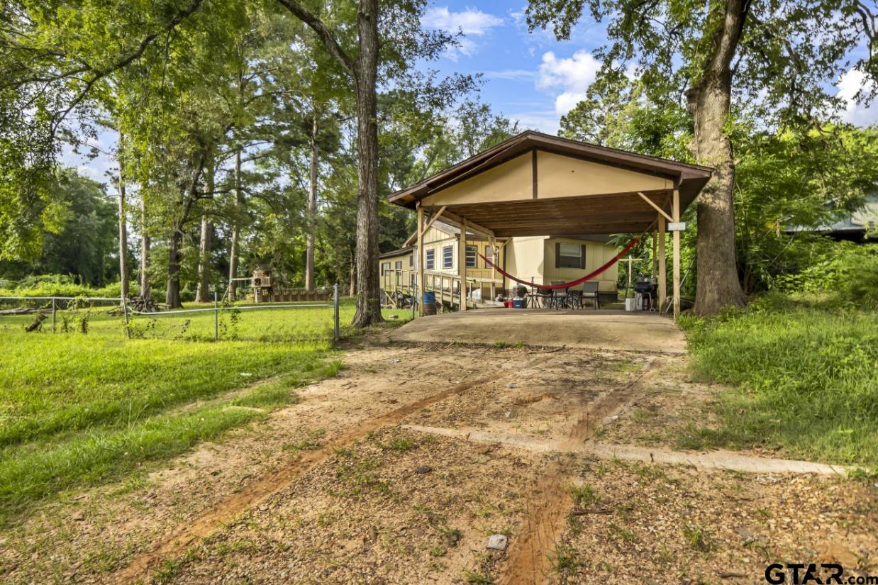 22530 Trailwood Road Flint, TX 75762 - Photo 2 of 8 a front view of a house with a yard